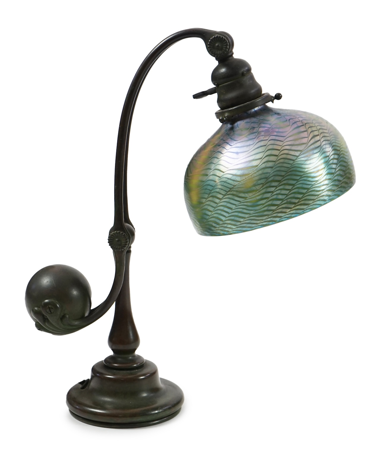 Tiffany Studios. A patinated bronze counter-balance desk lamp with ‘favrile’ glass shade, c.1905